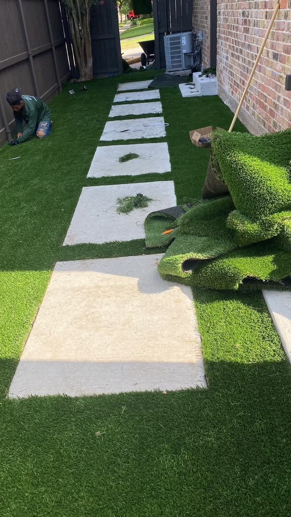 Artificial turf installation for an outdoor living area